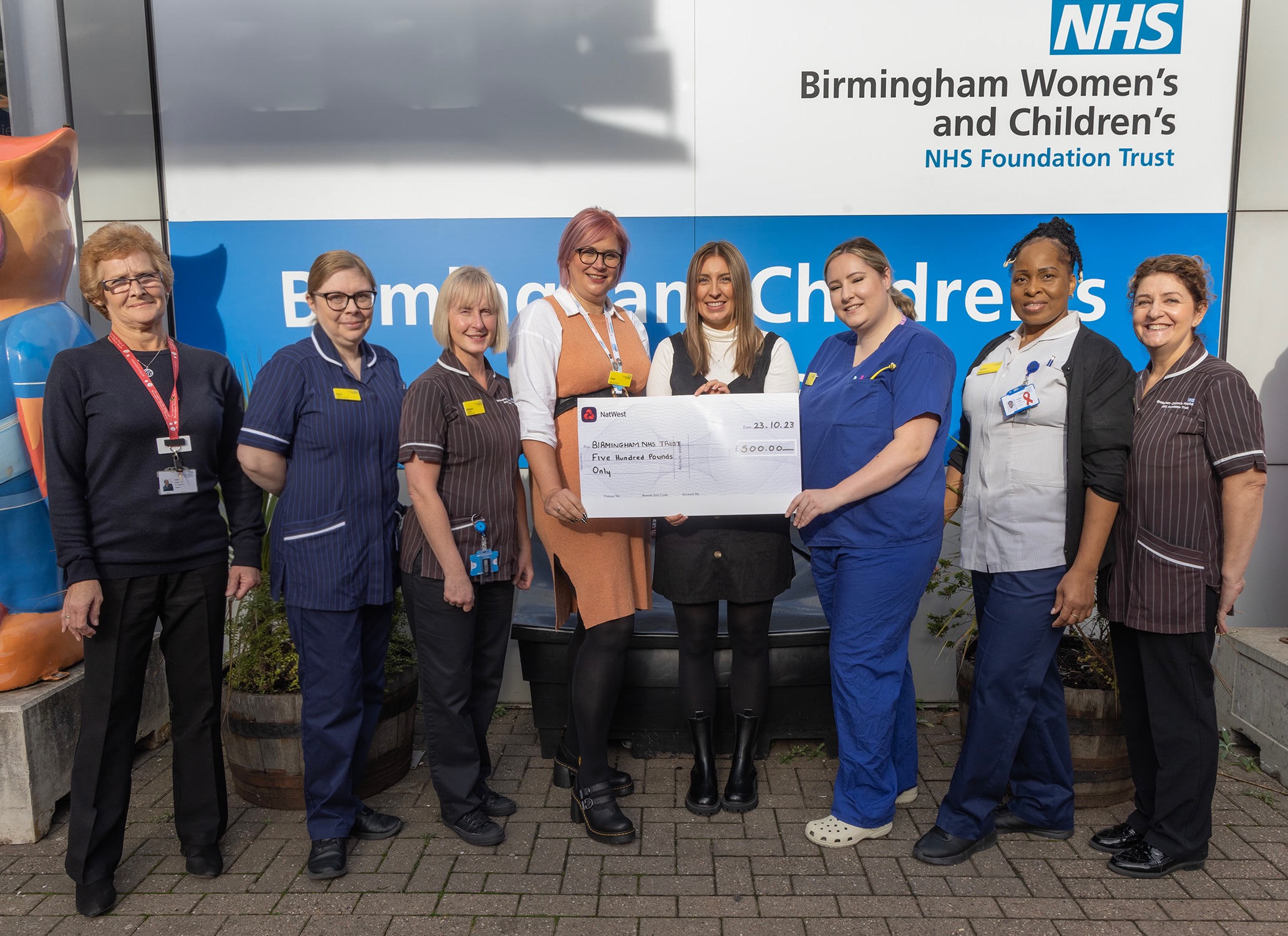 Jessica Porter, director of operations, surrounded by the staff of the radiology ward.
